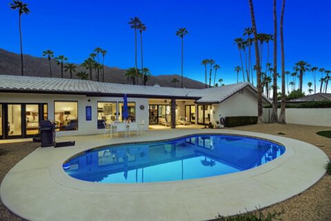 Palm Springs vacation rental with a pool and outdoor eating area